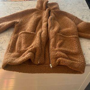A brown teddy bear jacket. It’s warm and very cozy. Barely barely worn